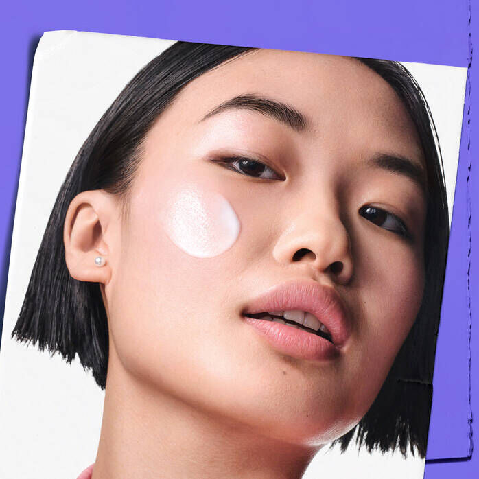 Model with Clearly Corrective™ Clarity-Boosting Soothing Emulsion sample on their cheek