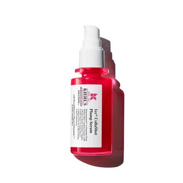 A vibrant red bottle of Kiehl's Hydro-Plumping Serum with a white pump dispenser. The product is centered against a plain white background, highlighting its bold packaging and label.​