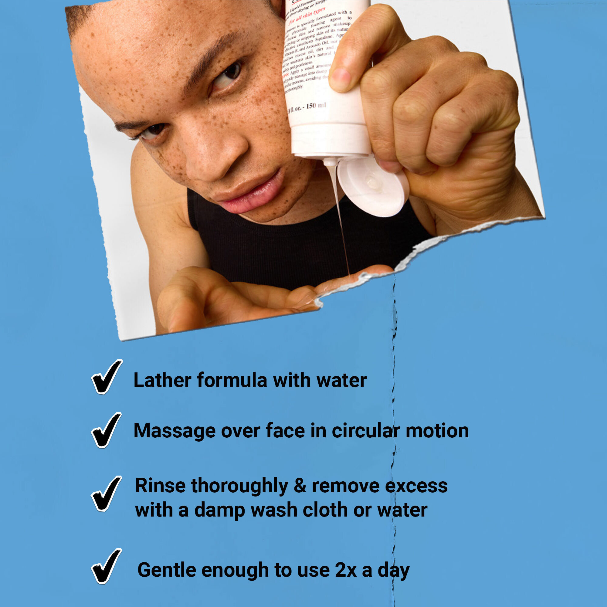 Product shot of Kiehl’s Ultra Facial Cleanser being held in front of a blue graphic background.